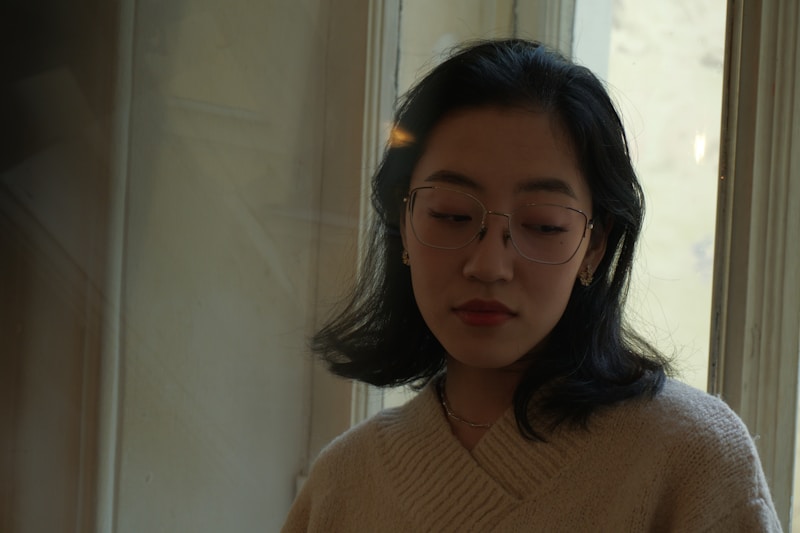 Refined Japanese lady in glasses indoors