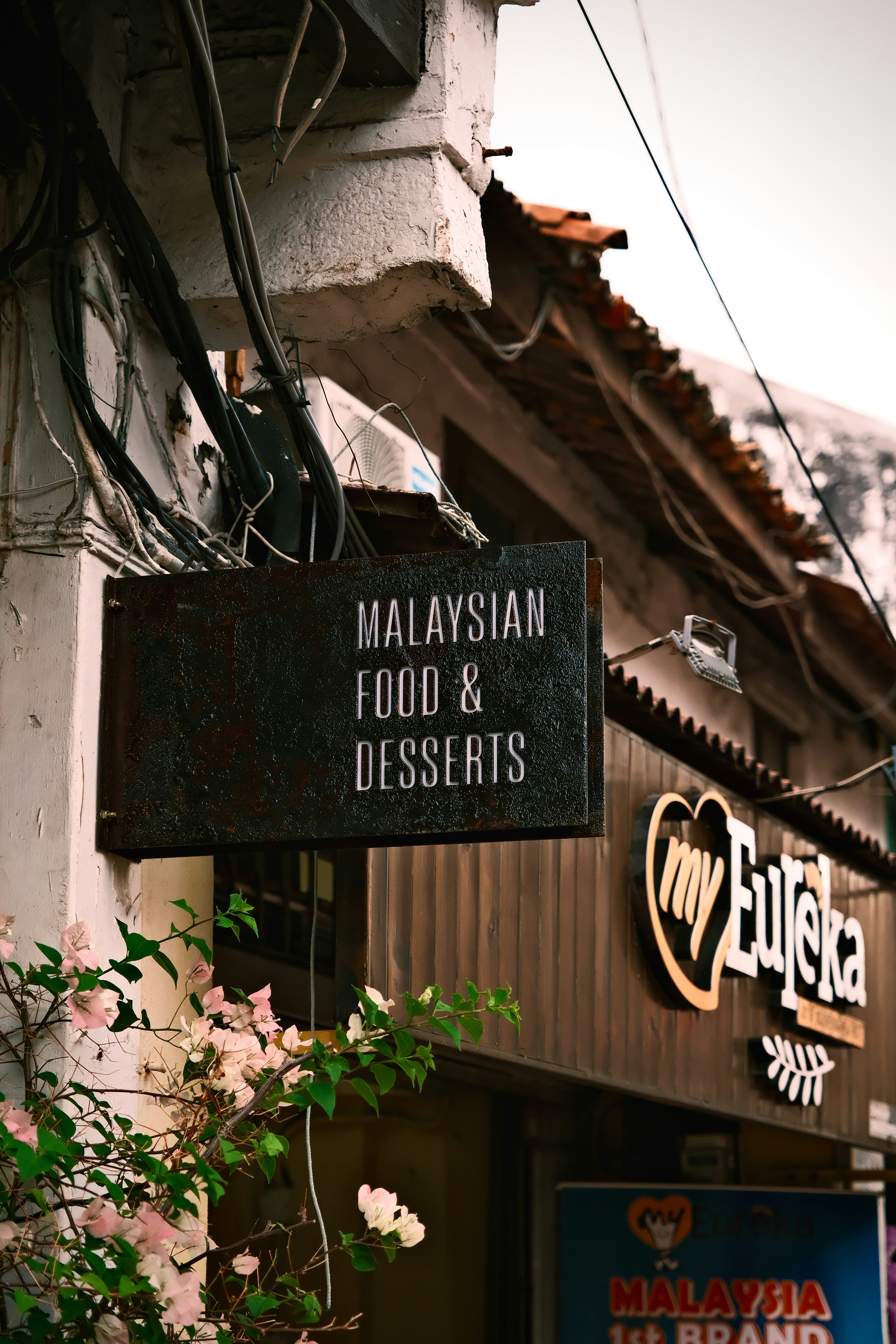 Malaysian food & desserts sign outside a restaurant