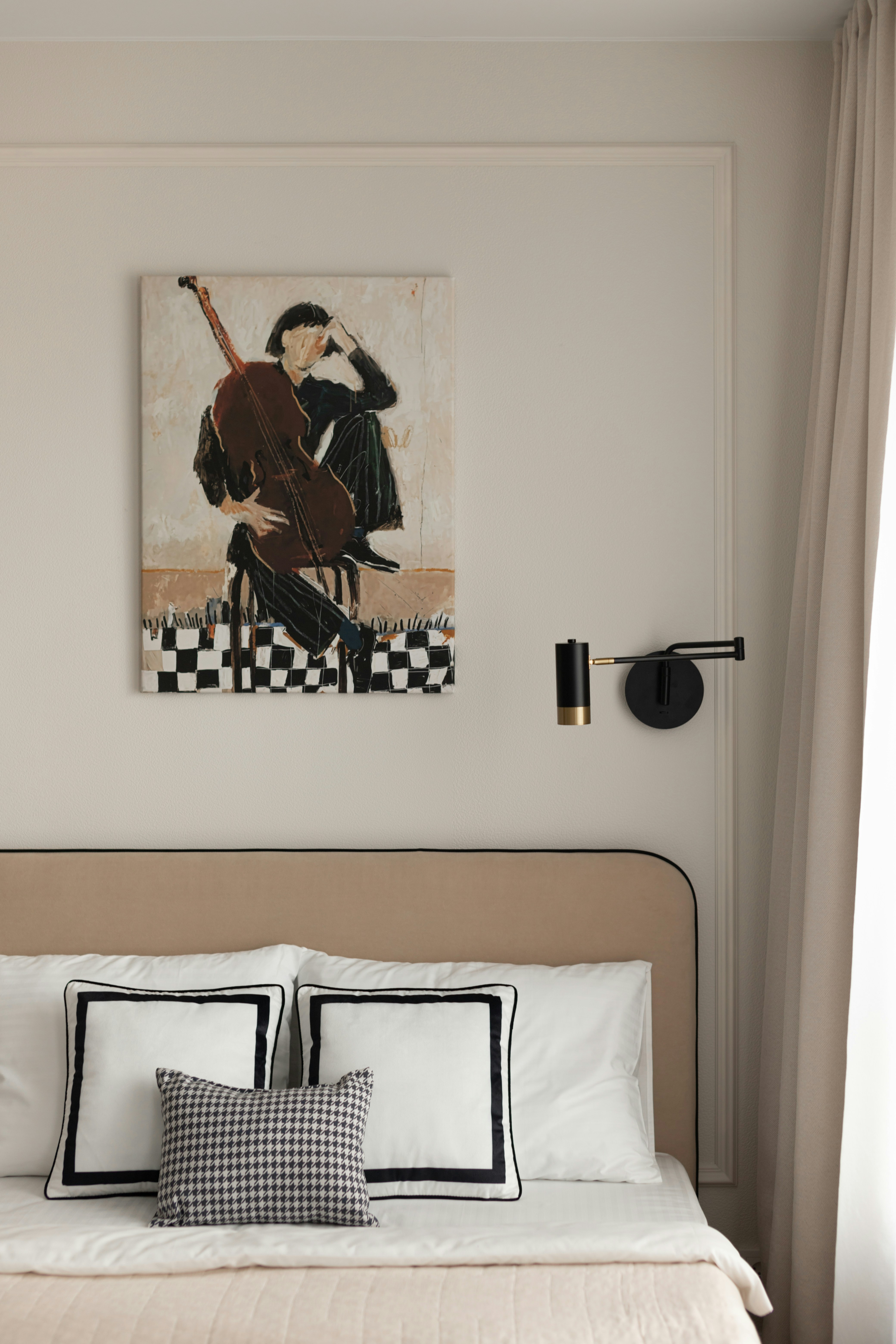 Bedroom with art and pillows on-bed pillows