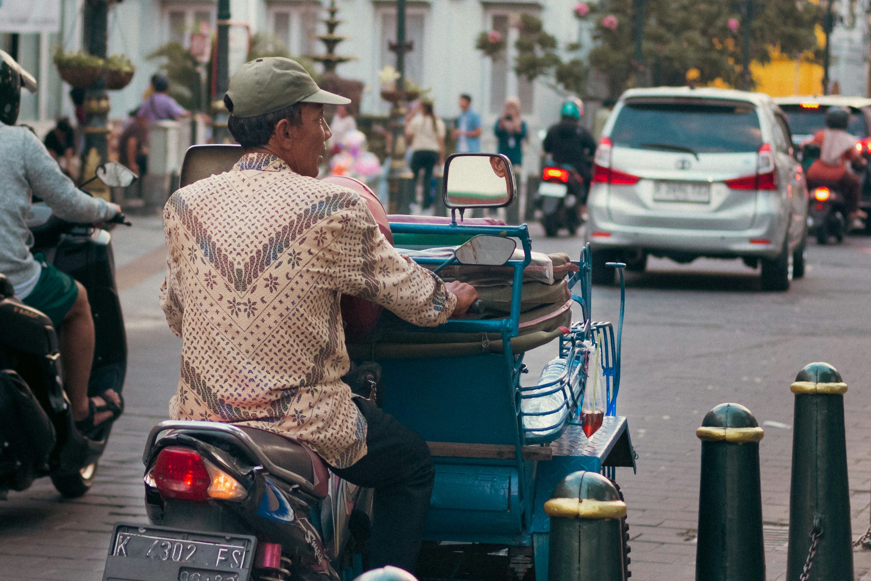 Man driving a motorcycle with sidecar on street
