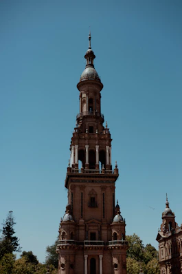 Ornate tower against a clear blue sky