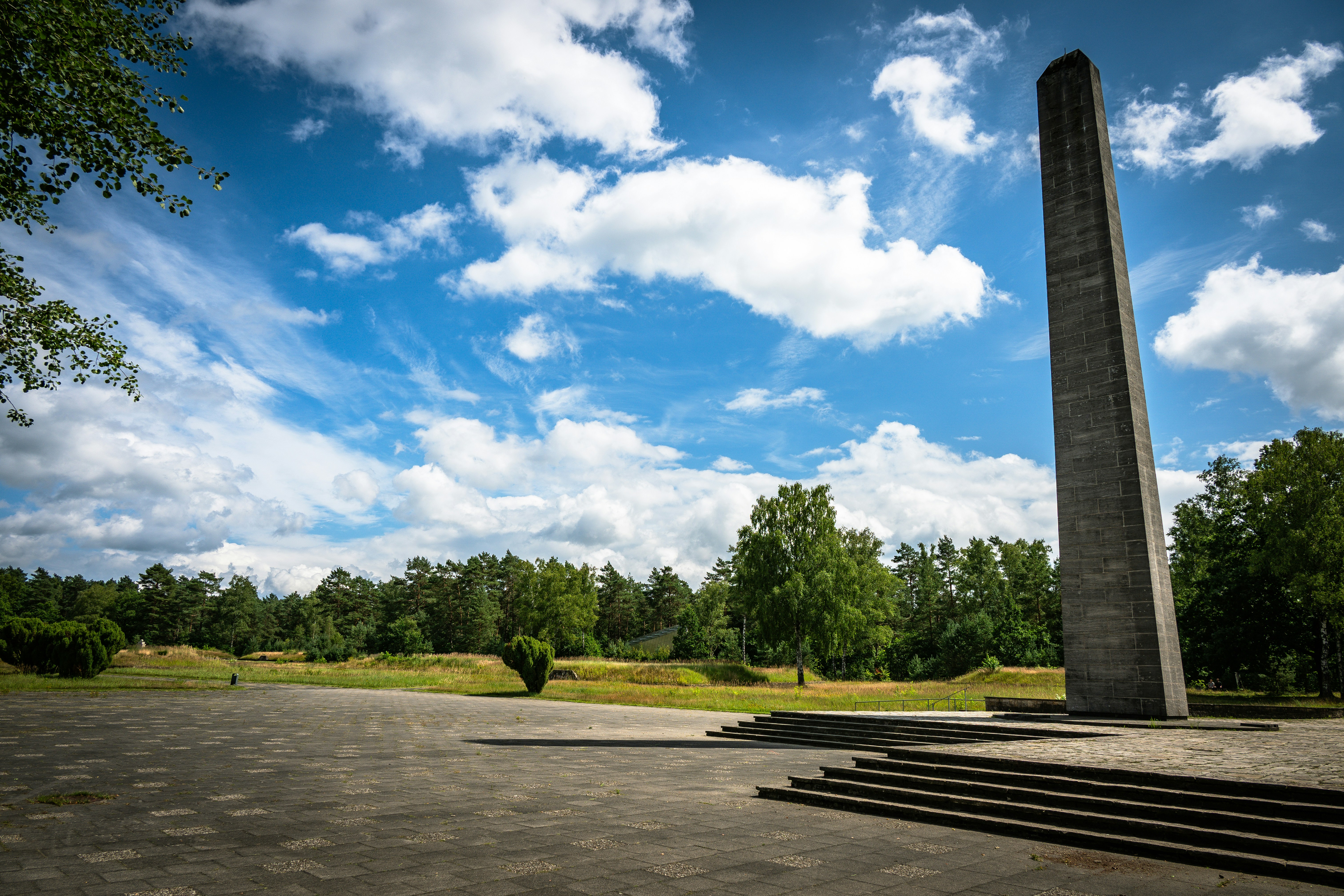 Tall obelisk monument in a grassy field