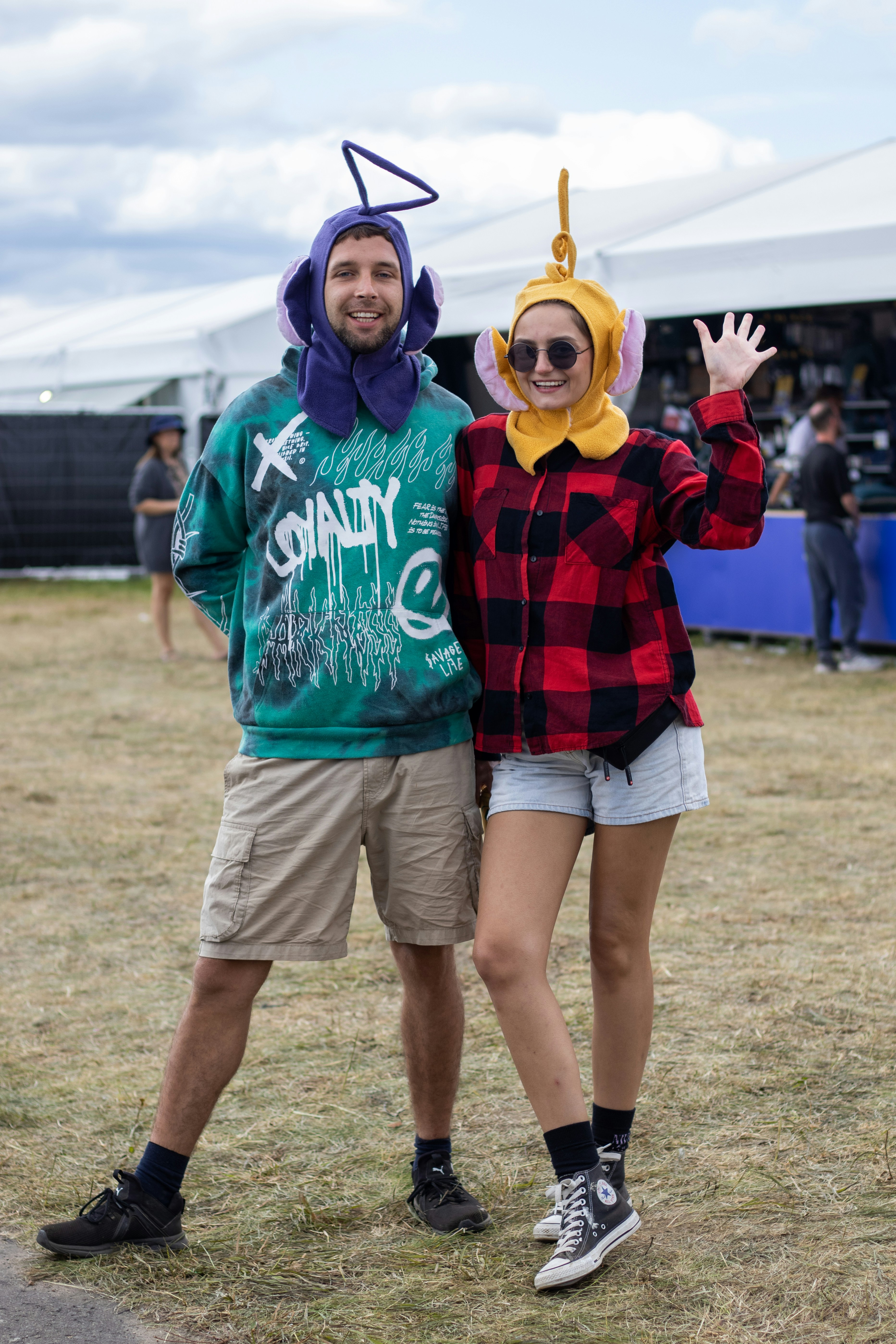 Couple dressed as teletubbies at an outdoor event