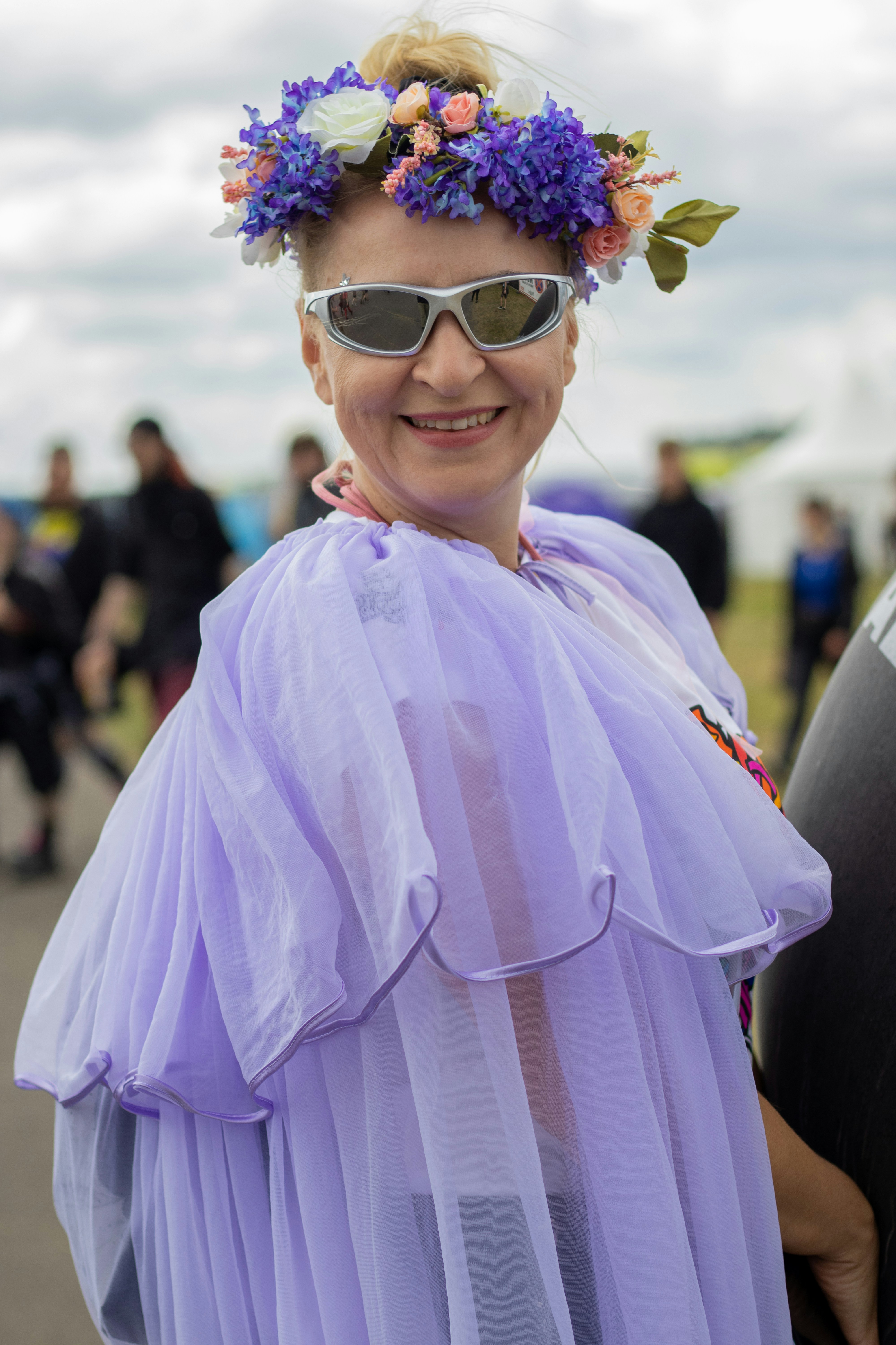 Woman wearing a flower crown and sunglasses