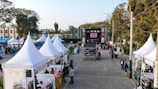 Outdoor festival with tents and a stage