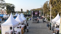 Outdoor festival with tents and a stage