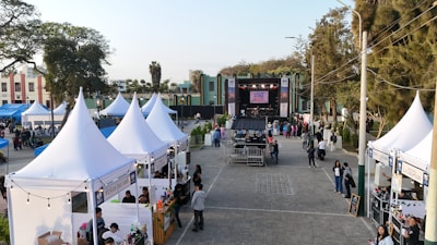 Outdoor festival with tents and a stage