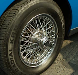 Close-up of a vintage car's spoked wheel