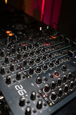 Close-up of a dj mixer with many knobs