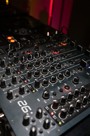 Close-up of a dj mixer with many knobs