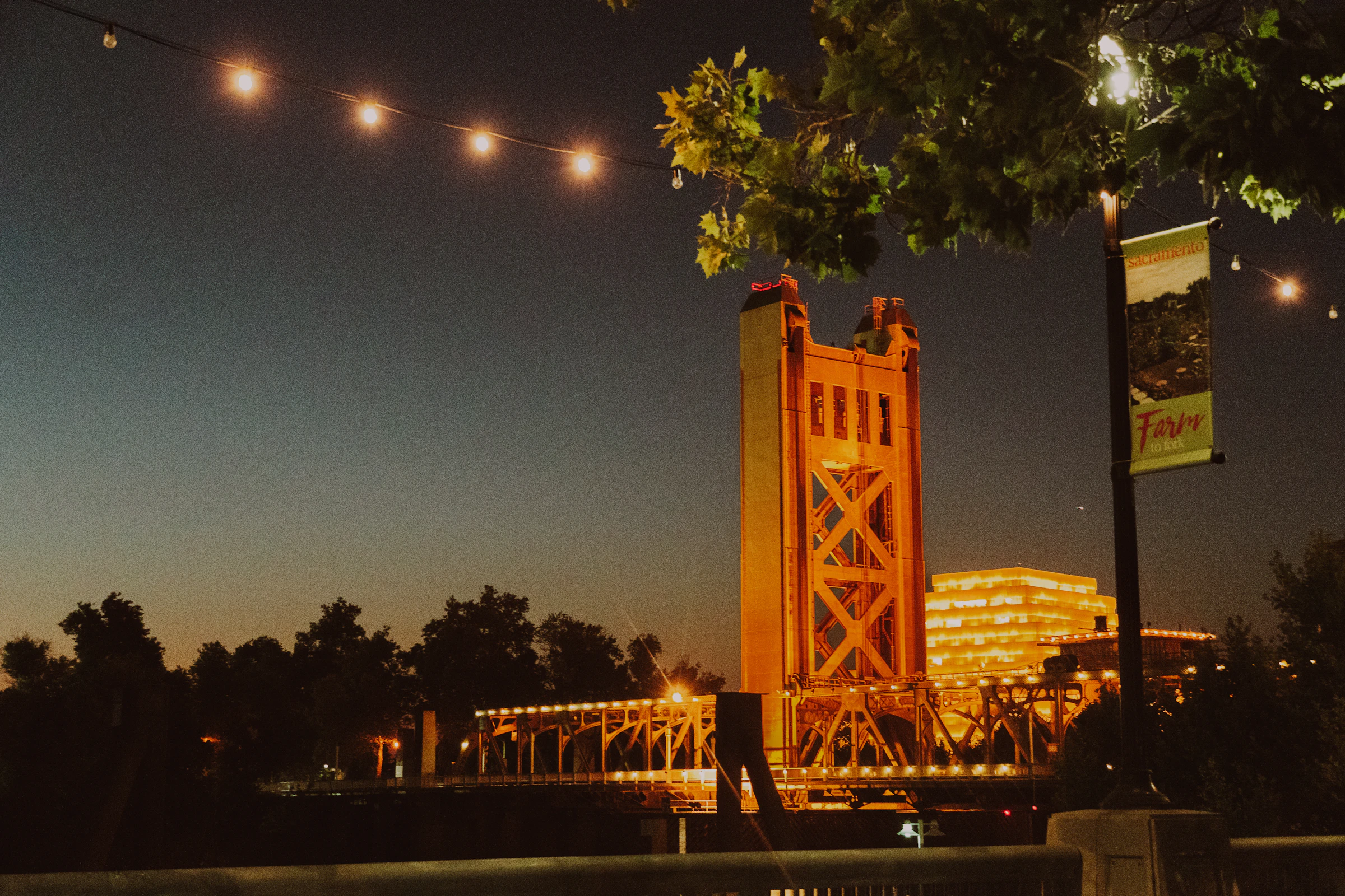 Sacramento's Tower Bridge lit gold at night