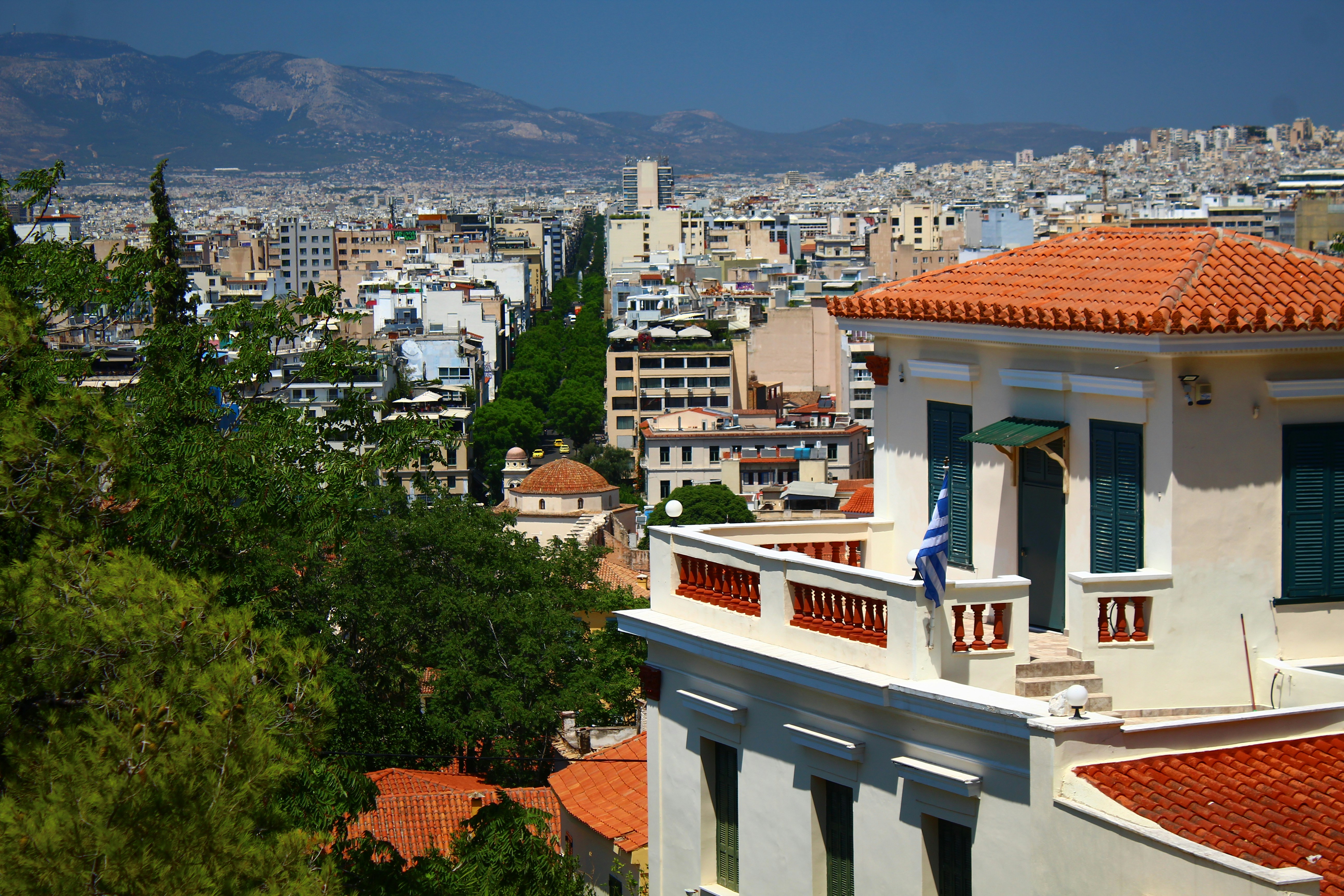 View of athens cityscape with buildings and greenery