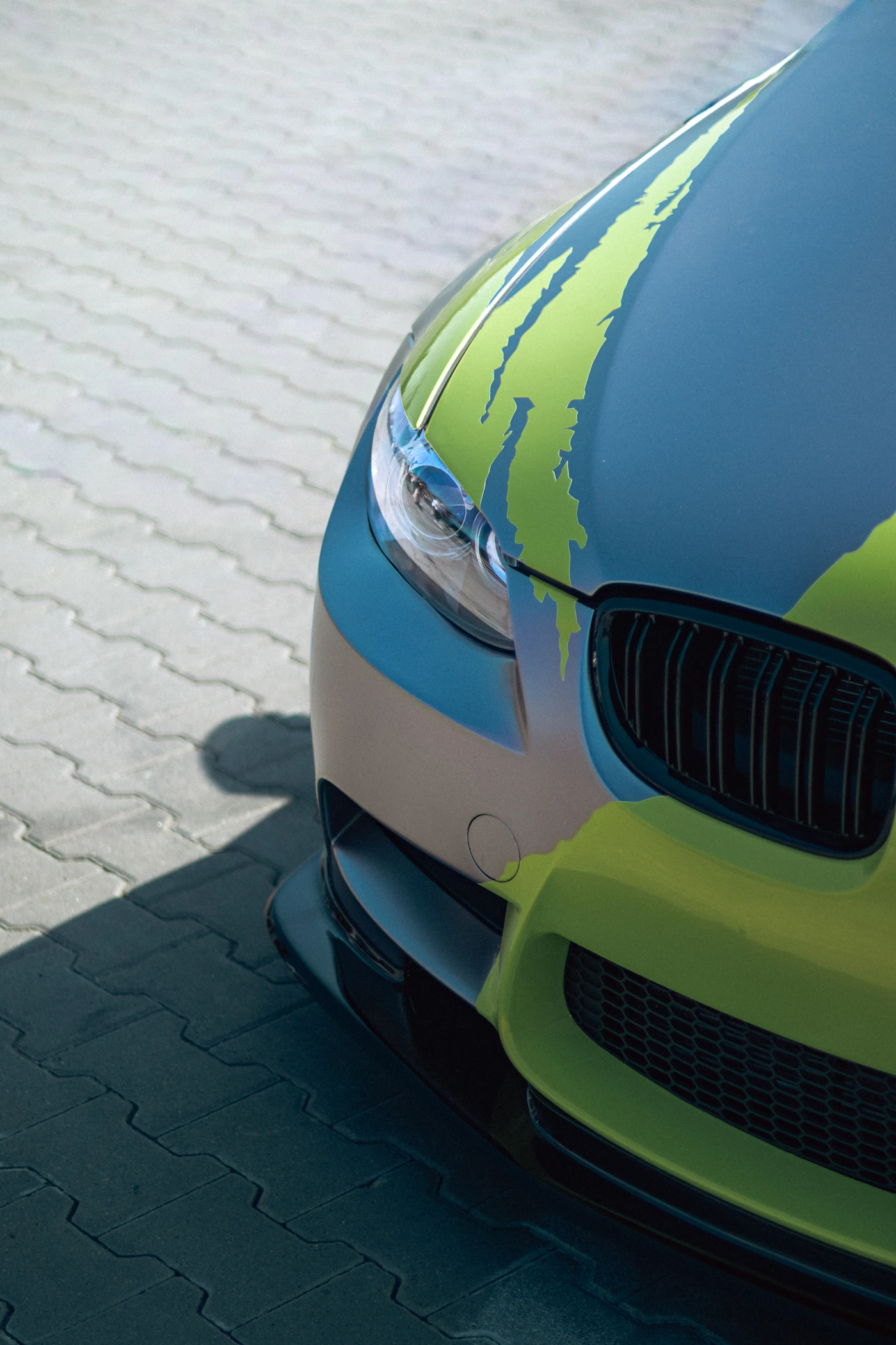 Modern car with abstract green graphic wrap