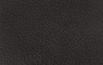 Dark brown textured leather surface