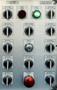 Control panel with multiple switches and emergency stop button