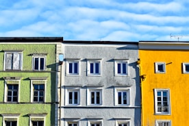 Colorful buildings with windows under a blue sky