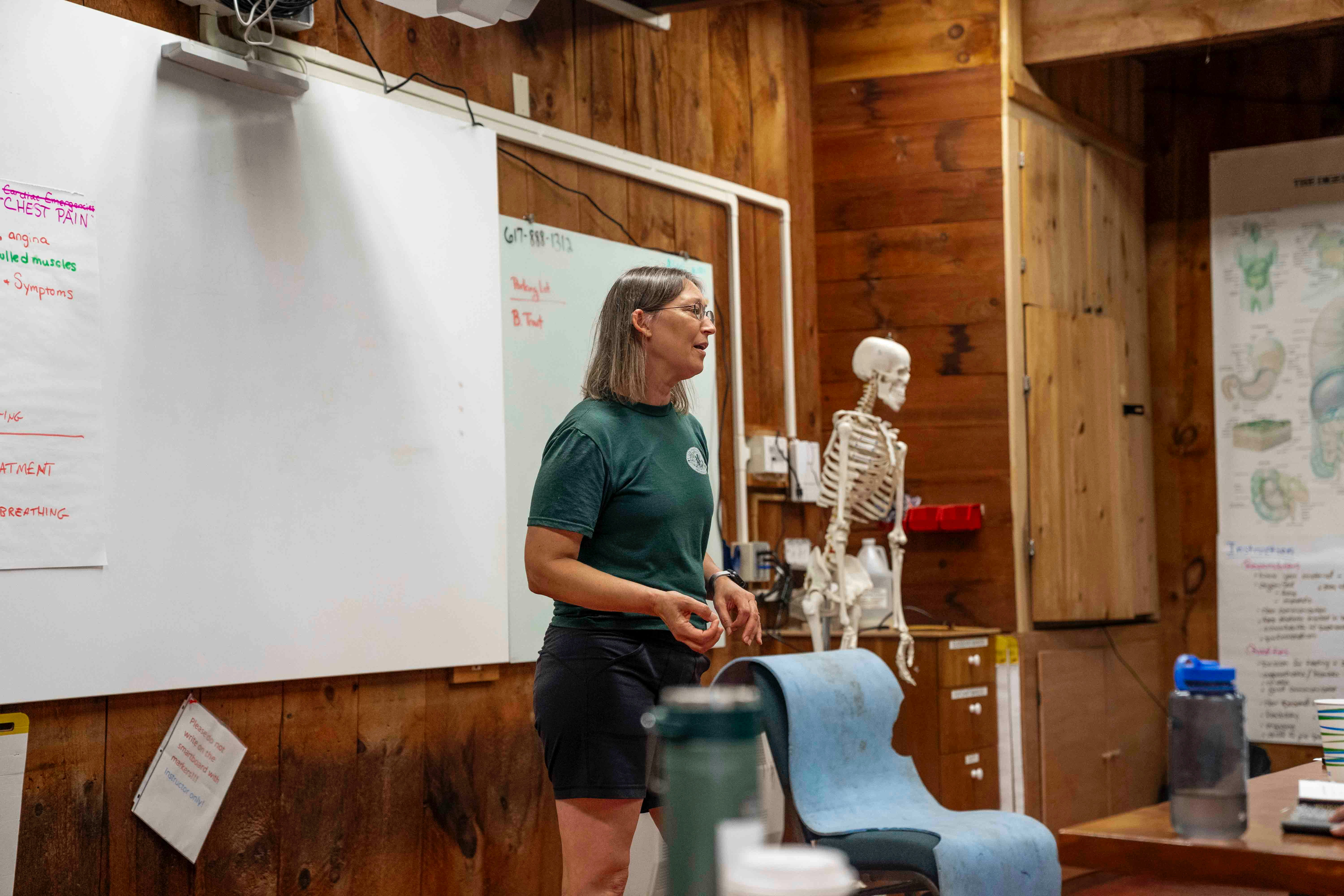 chiropractor explaining spinal model - prenatal chiropractor near me