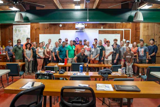 Group of people gathered in a classroom setting