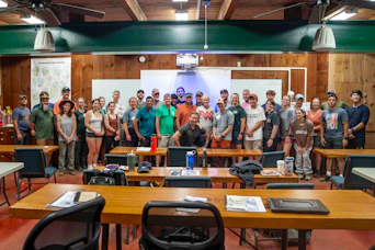 Group of people gathered in a classroom setting