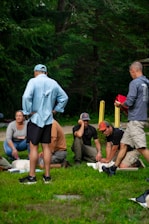 Group learning cpr outdoors with instructor demonstration
