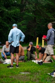 Group learning cpr outdoors with instructor demonstration