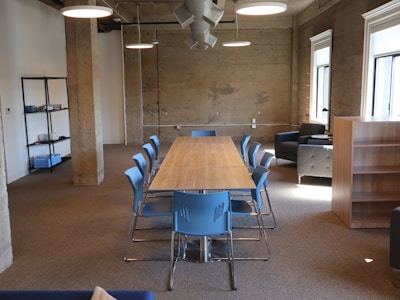 Empty conference room with a long table and chairs