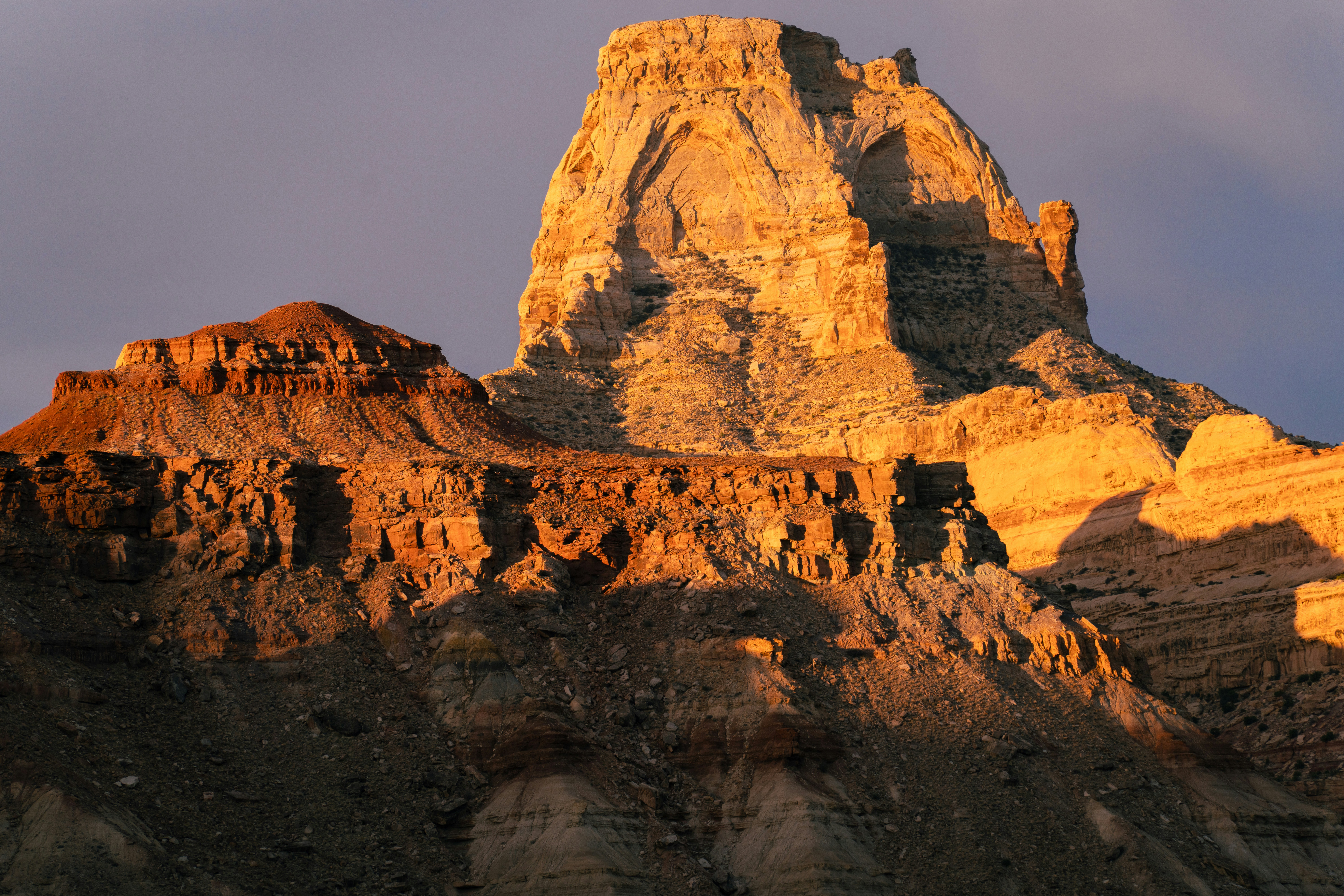 Sunlit rock formations in a desert landscape