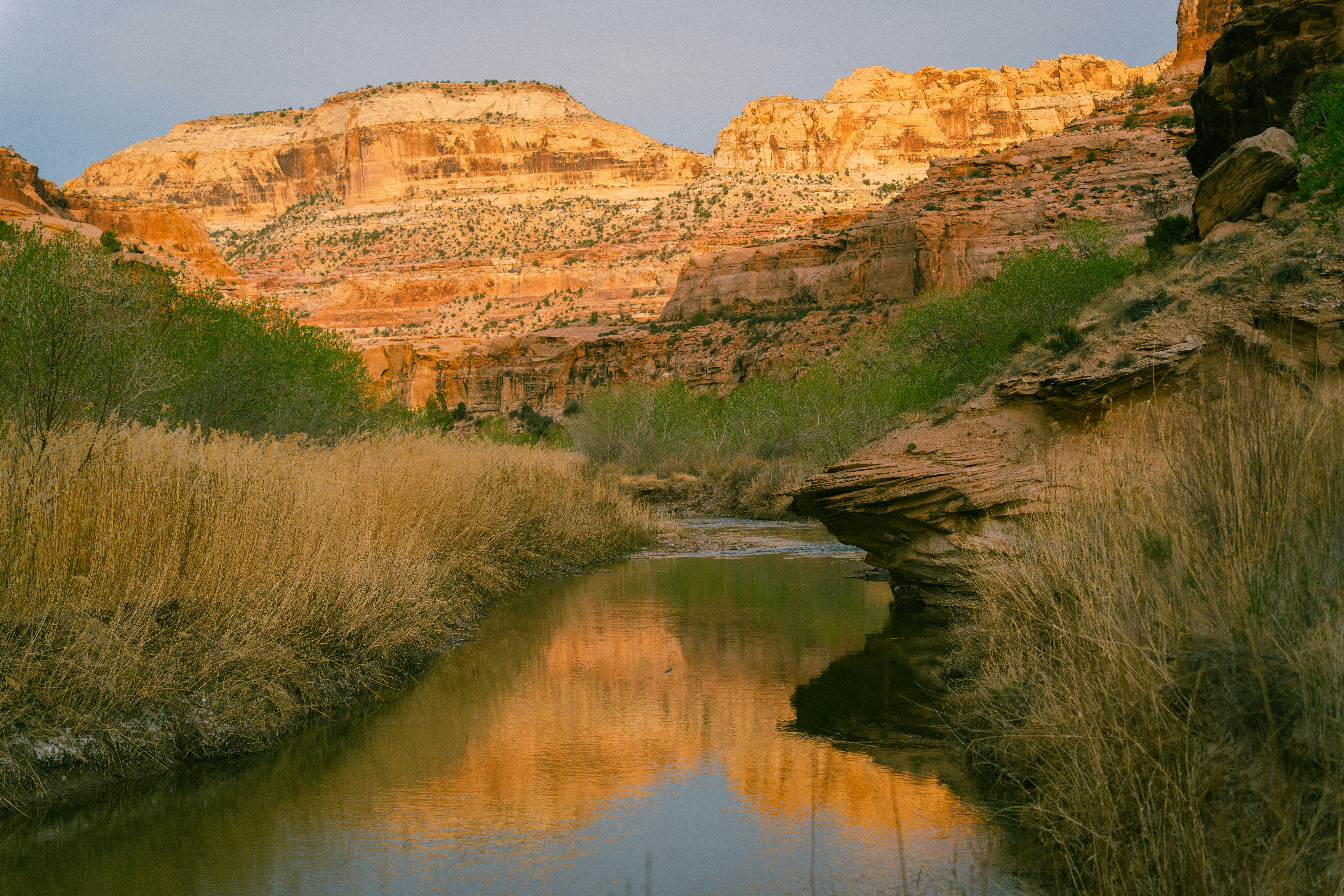 River flowing through a canyon at sunset