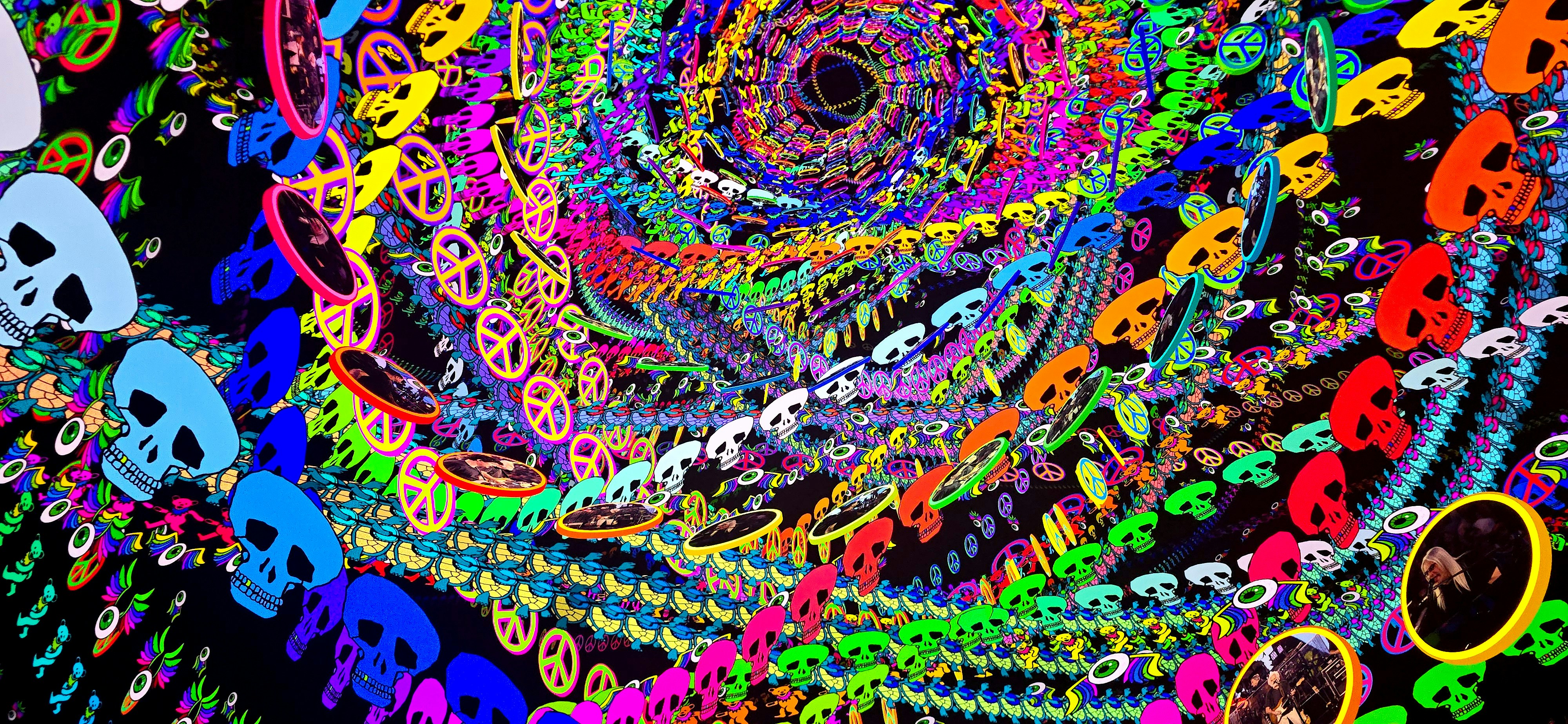 Colorful skull garlands arranged in a spiral vortex pattern