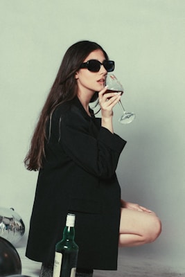 Person sipping red wine