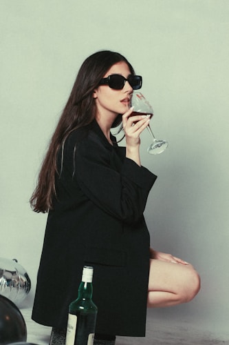 Person sipping red wine