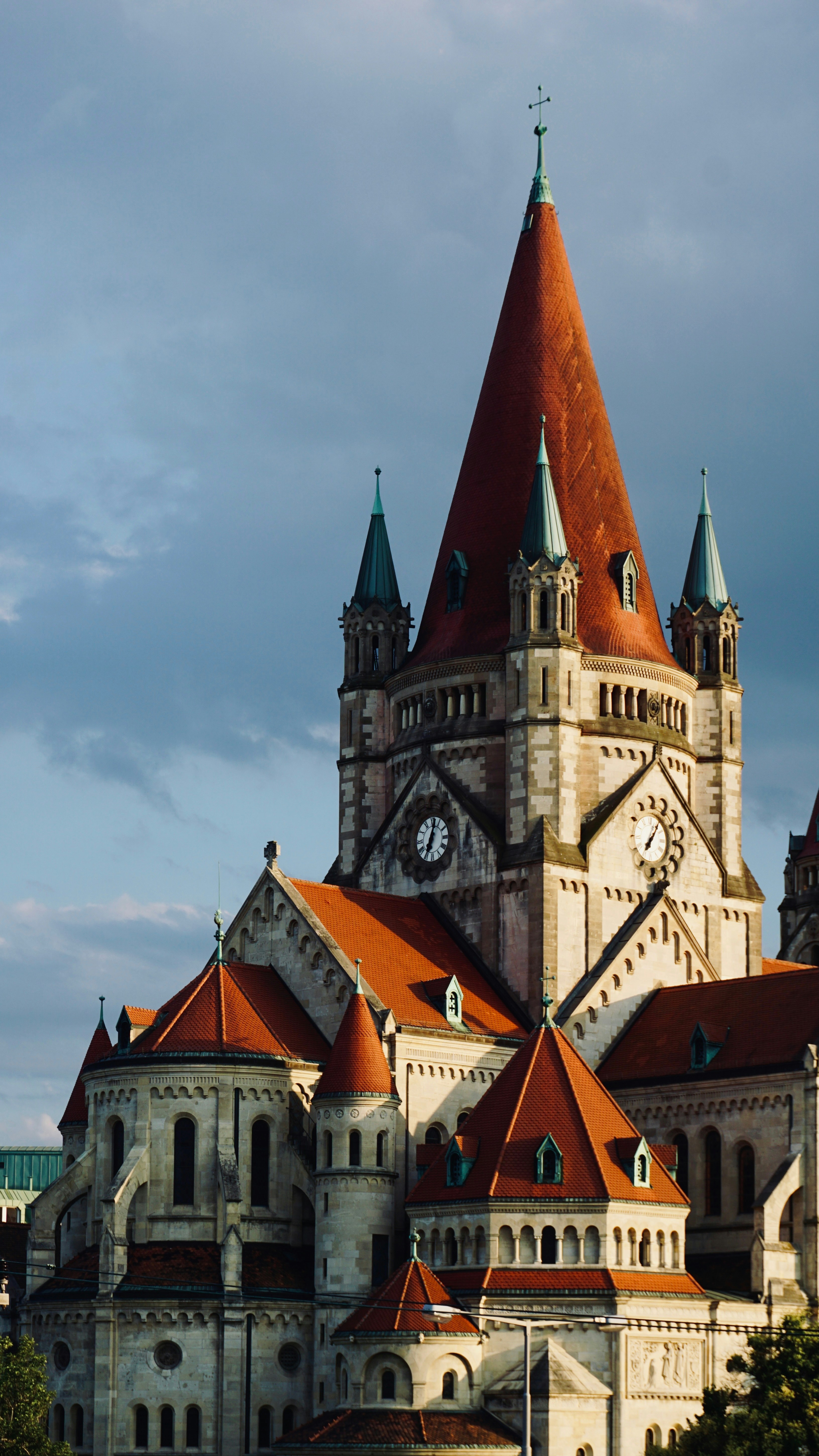 Majestic church with a tall red spire against the sky