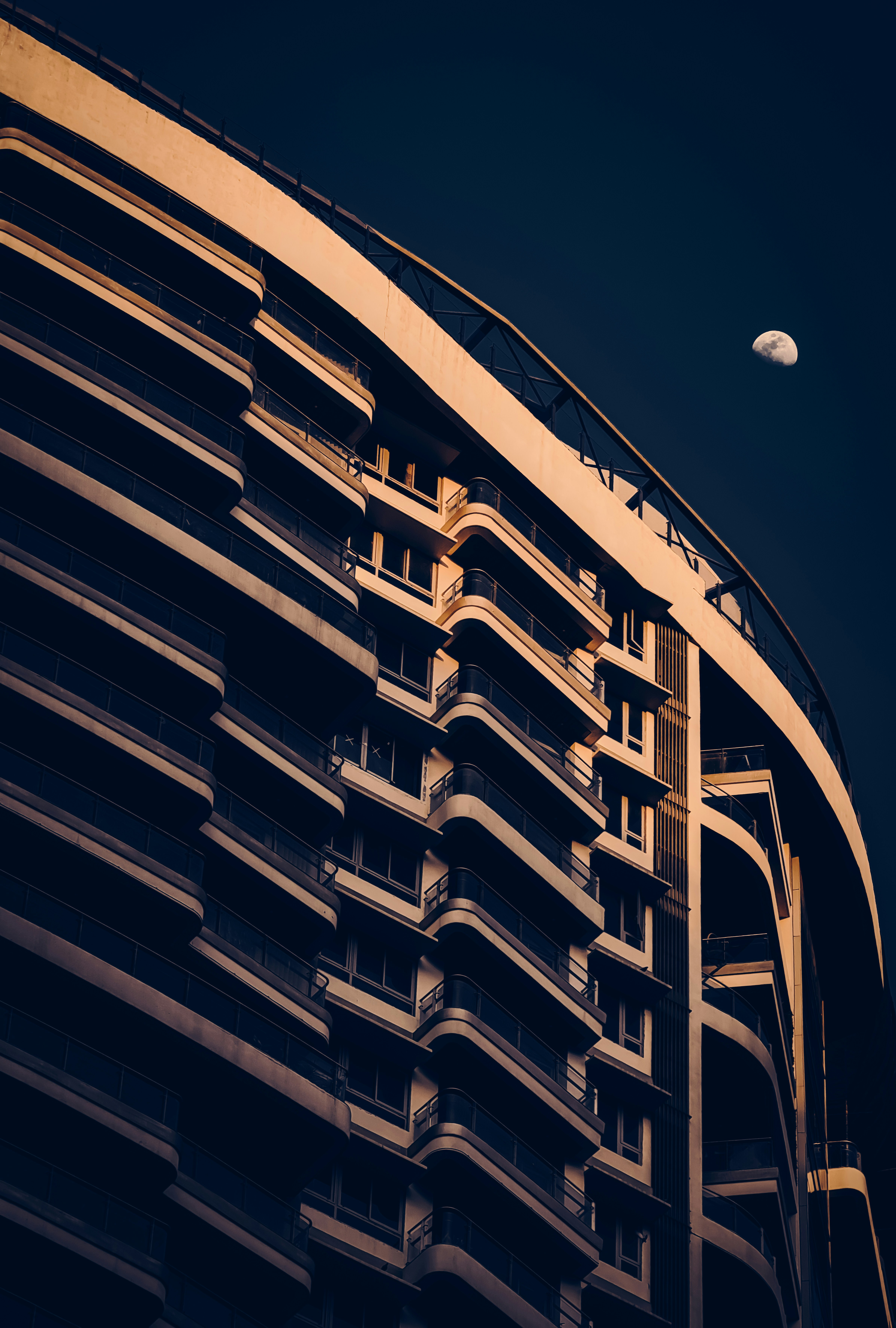 Modern building architecture with moon in the sky