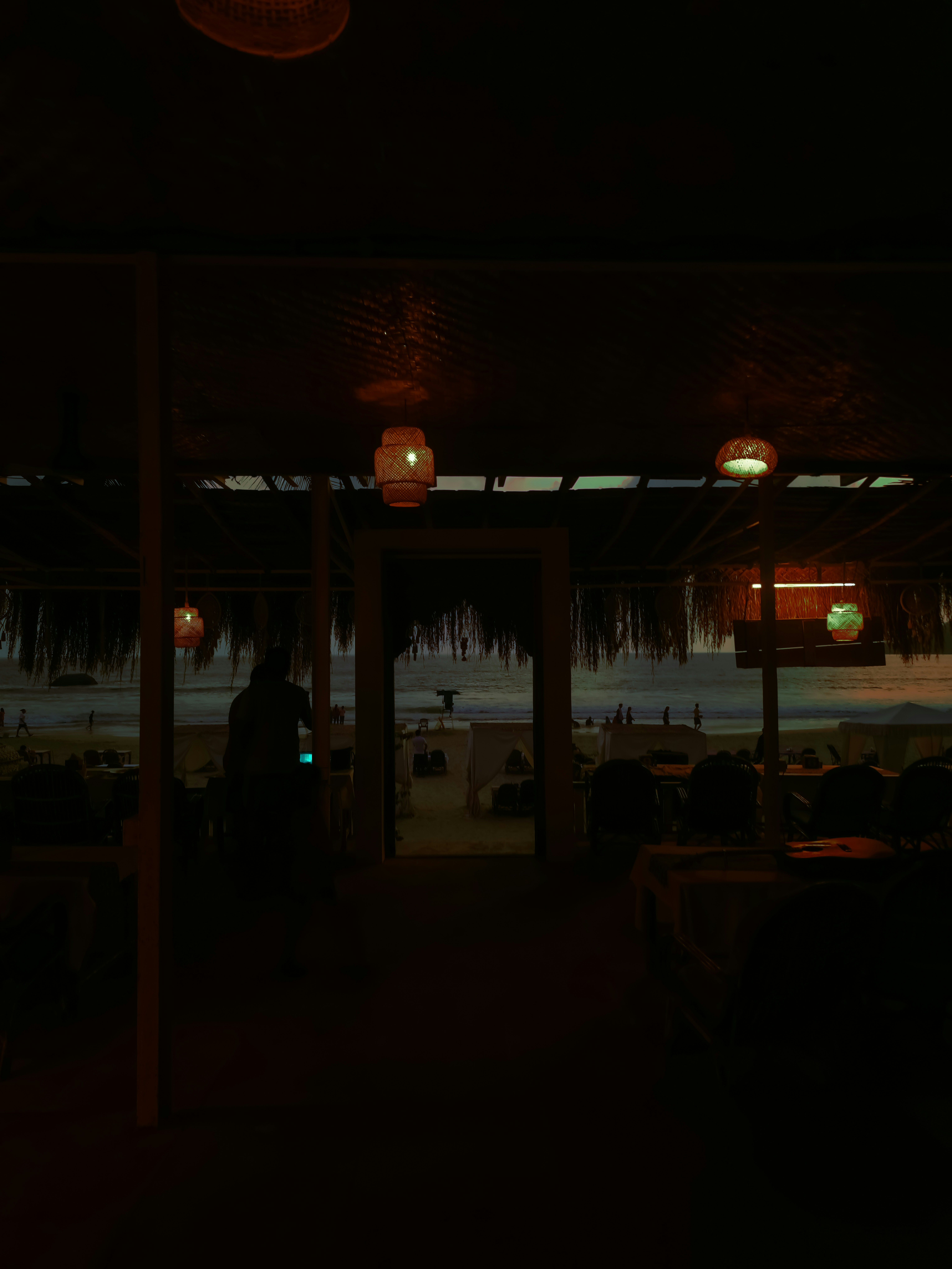 Beachside restaurant with view of ocean at dusk