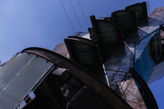 Modern building with geometric shapes against blue sky