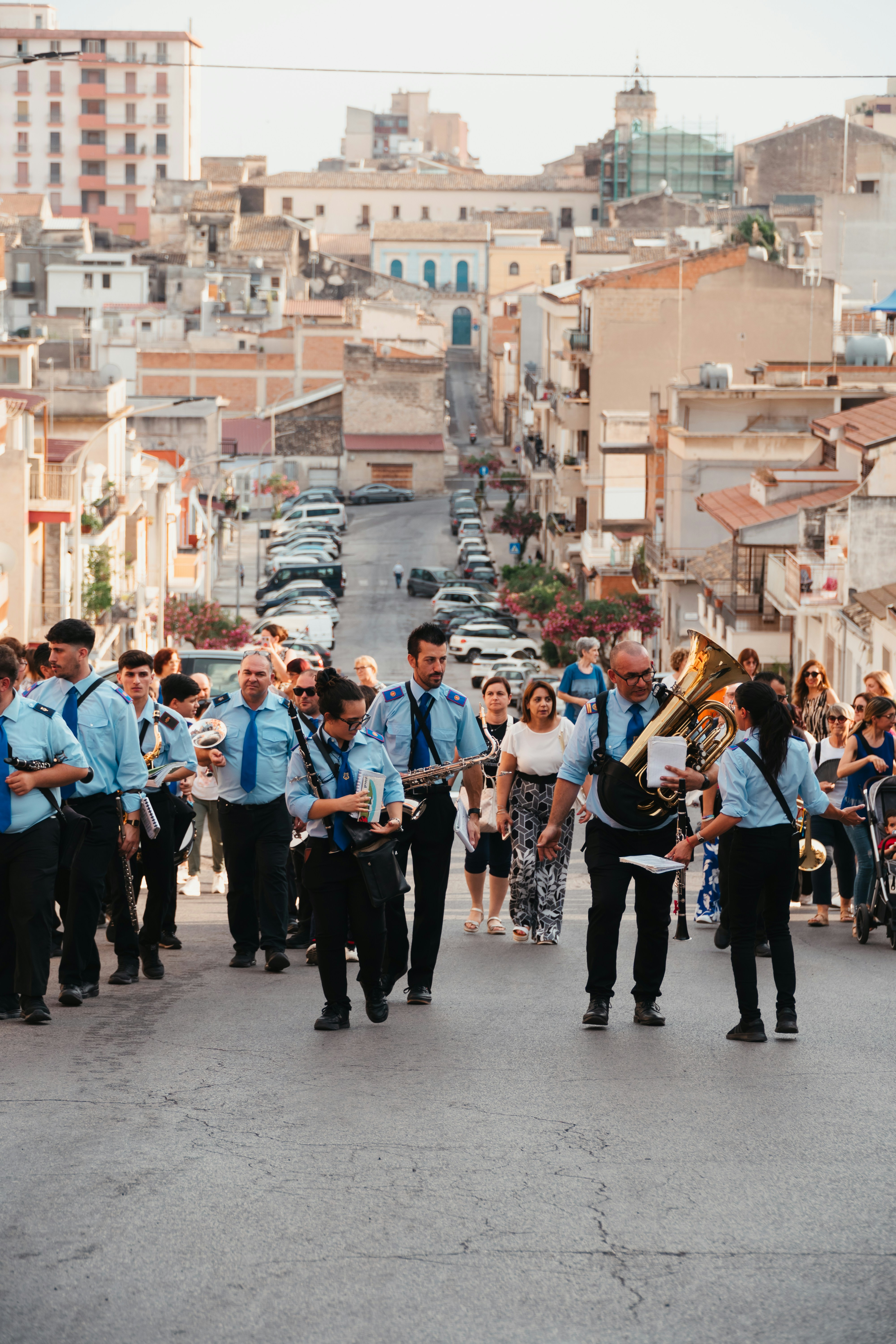 Band marching down a sunny street in a european town