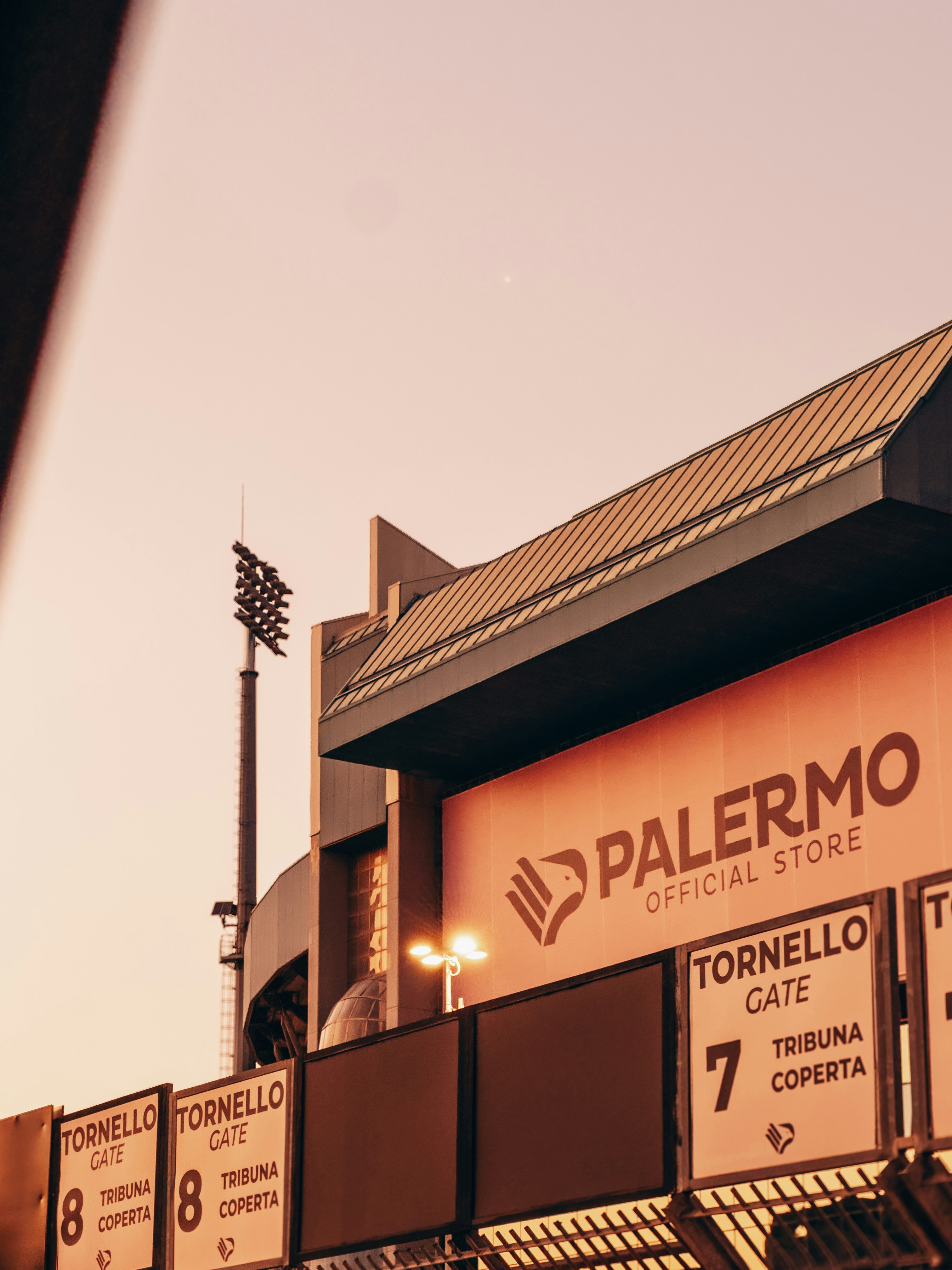 Stadium exterior with palermo official store sign.