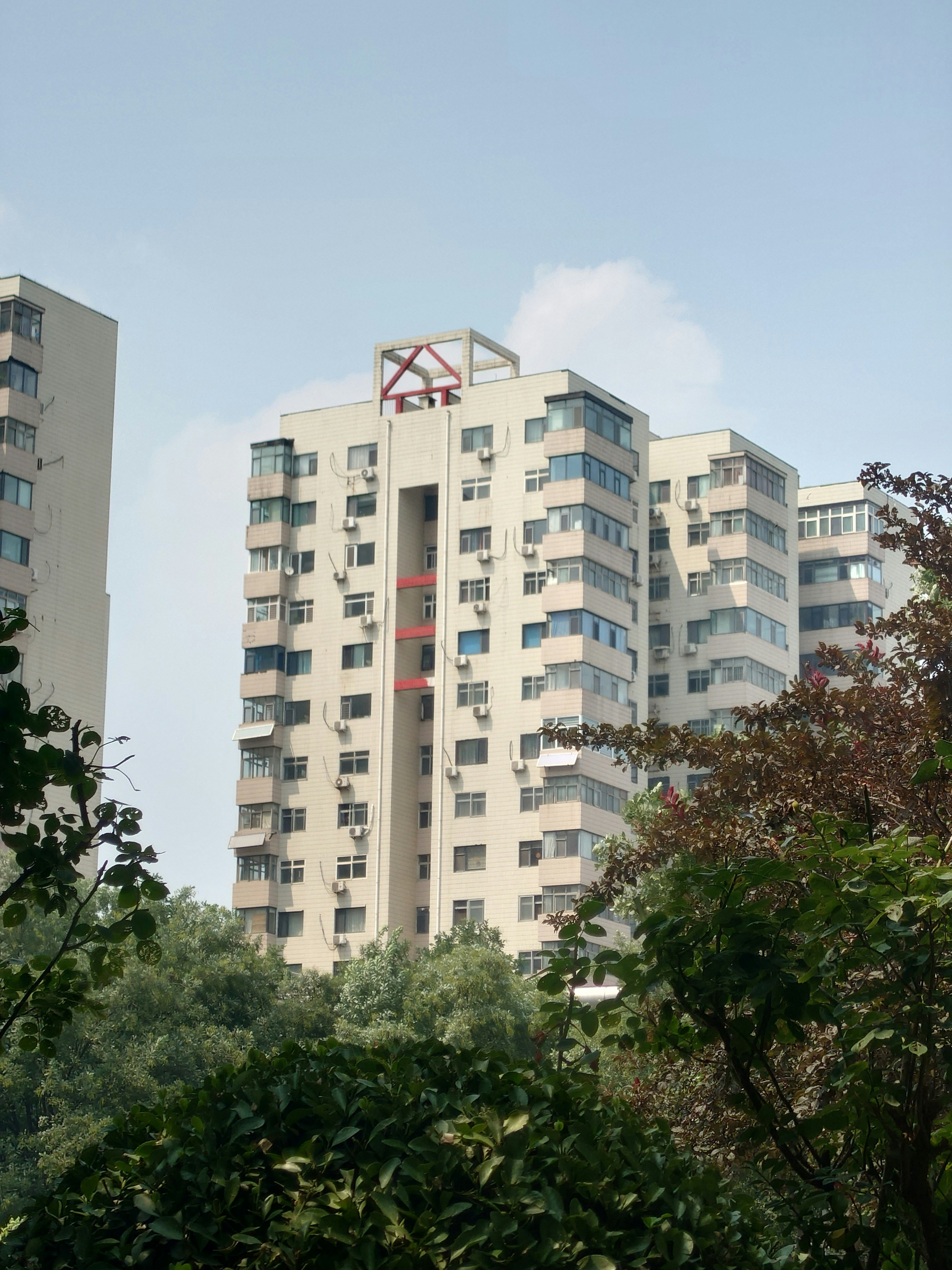 Tall apartment buildings against a blue sky