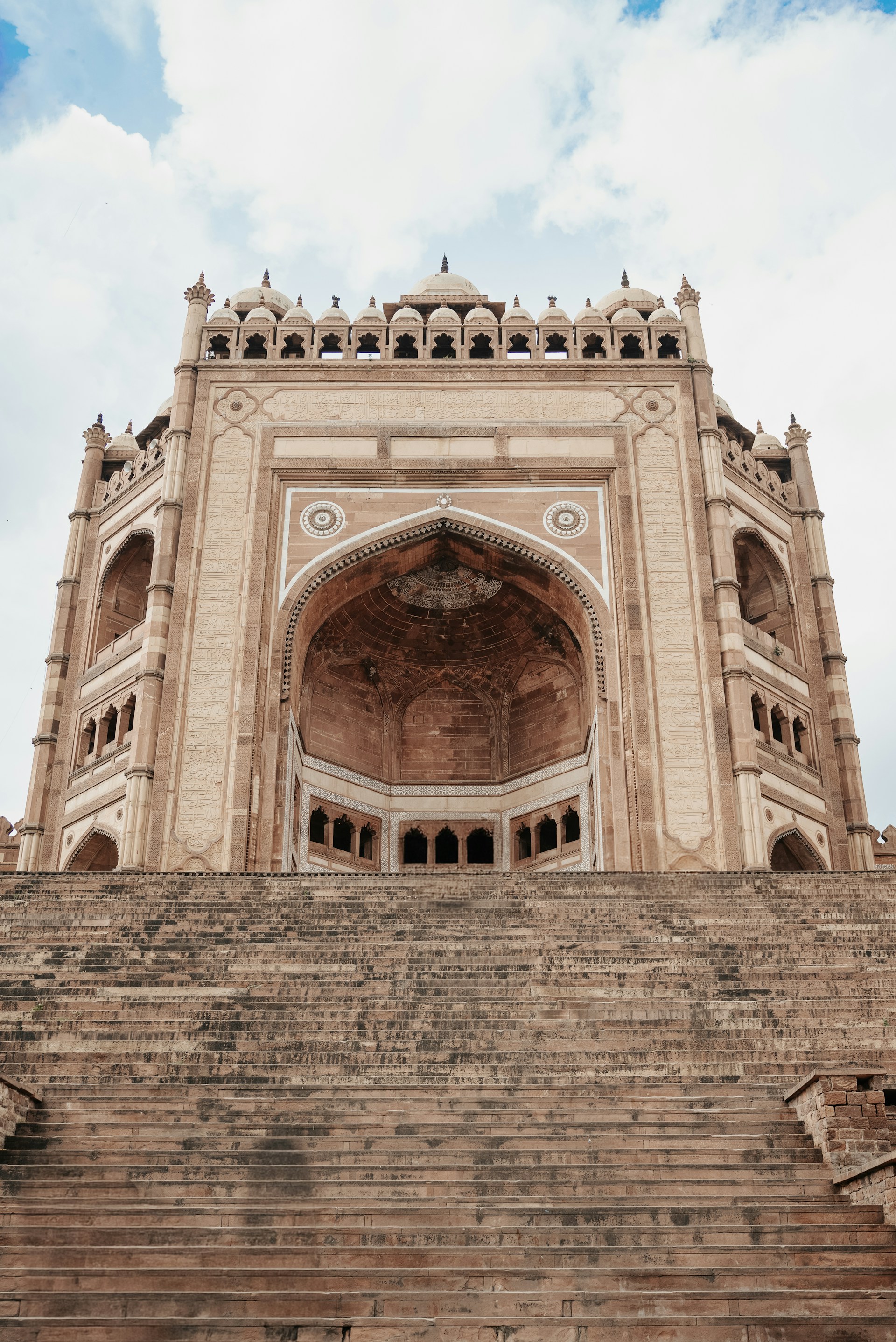 Grand ancient indian architecture with wide stone steps.