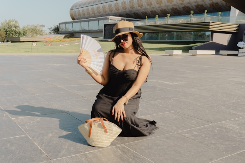 Sophisticated lady in black dress outdoors