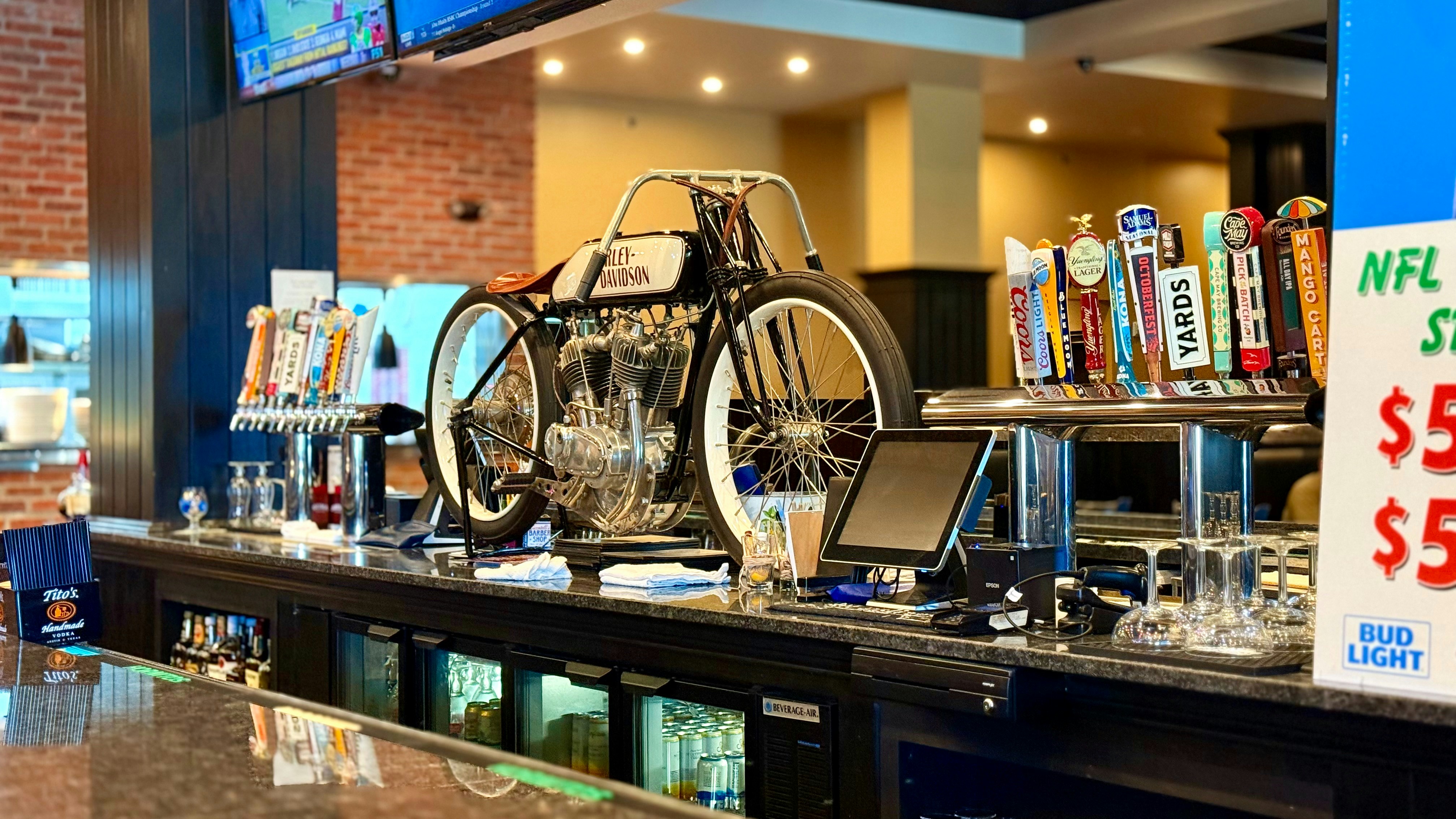 Old Harley behind the bar