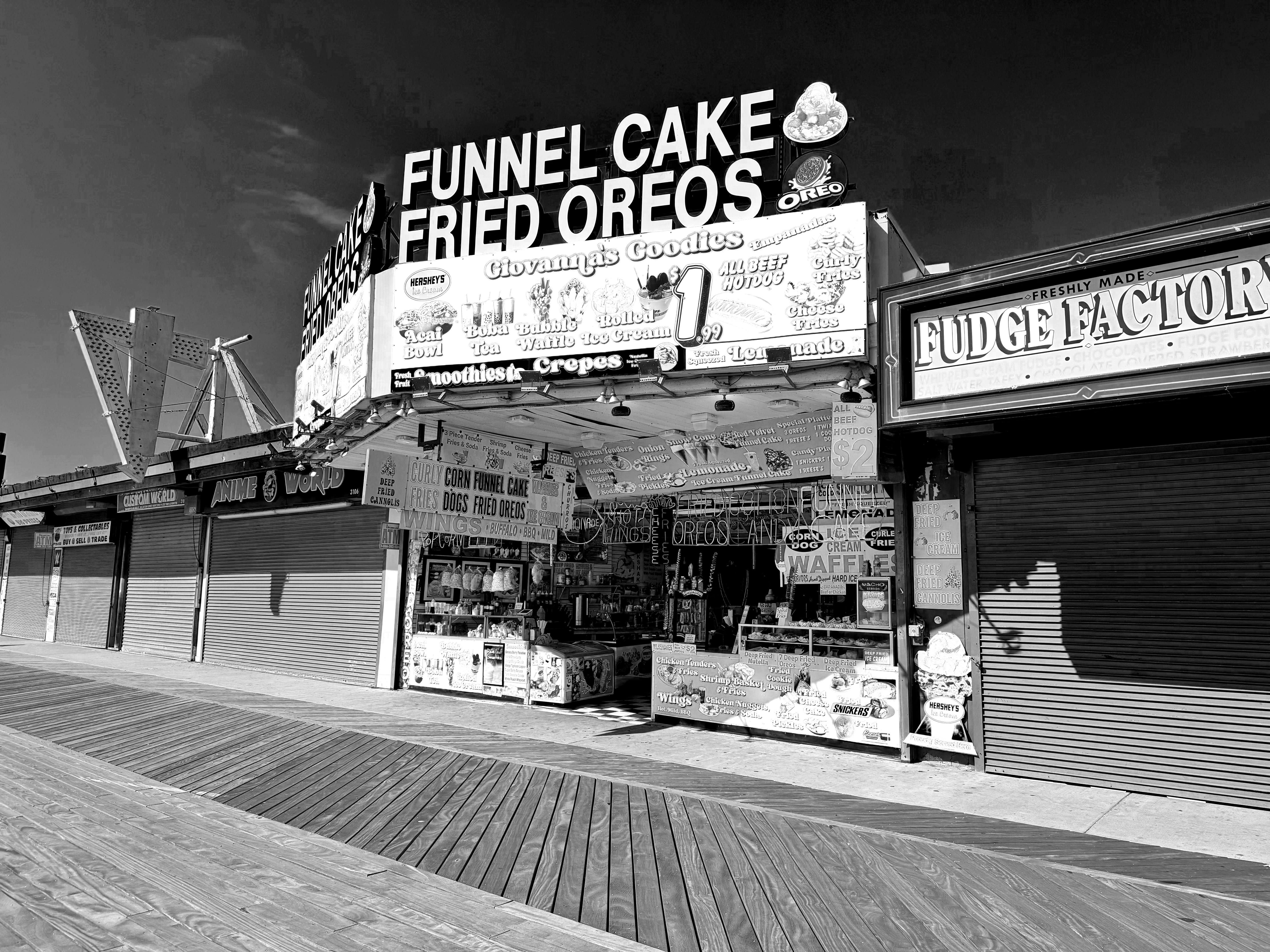 Boardwalk food stand selling funnel cakes and fried oreos