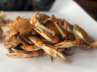Pile of cooked crab legs and claws
