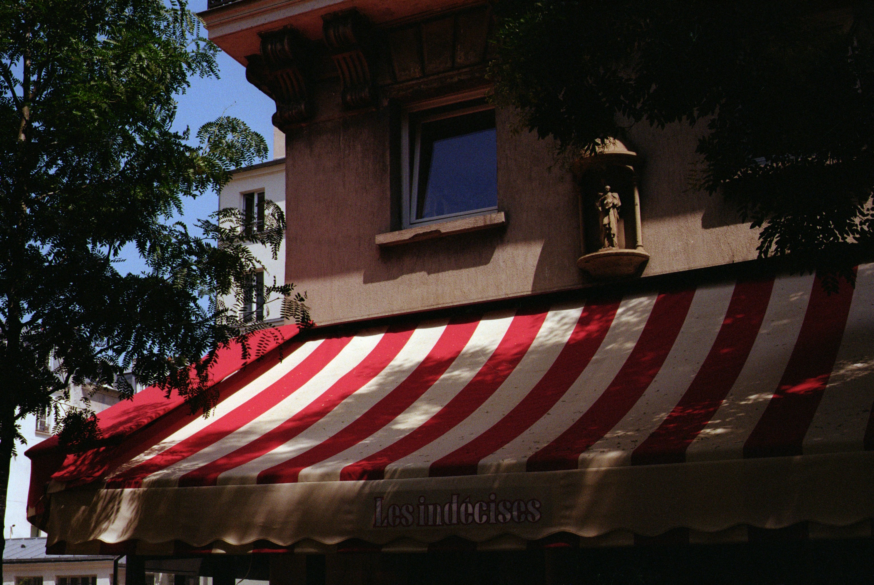 Red and white striped awning on building facade