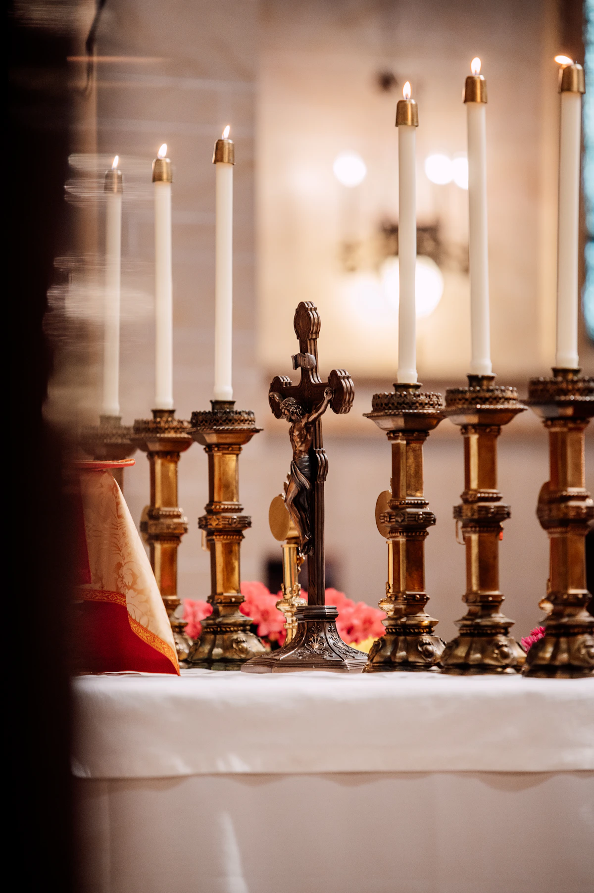 A crucifix and lighted candles on a Catholic altar