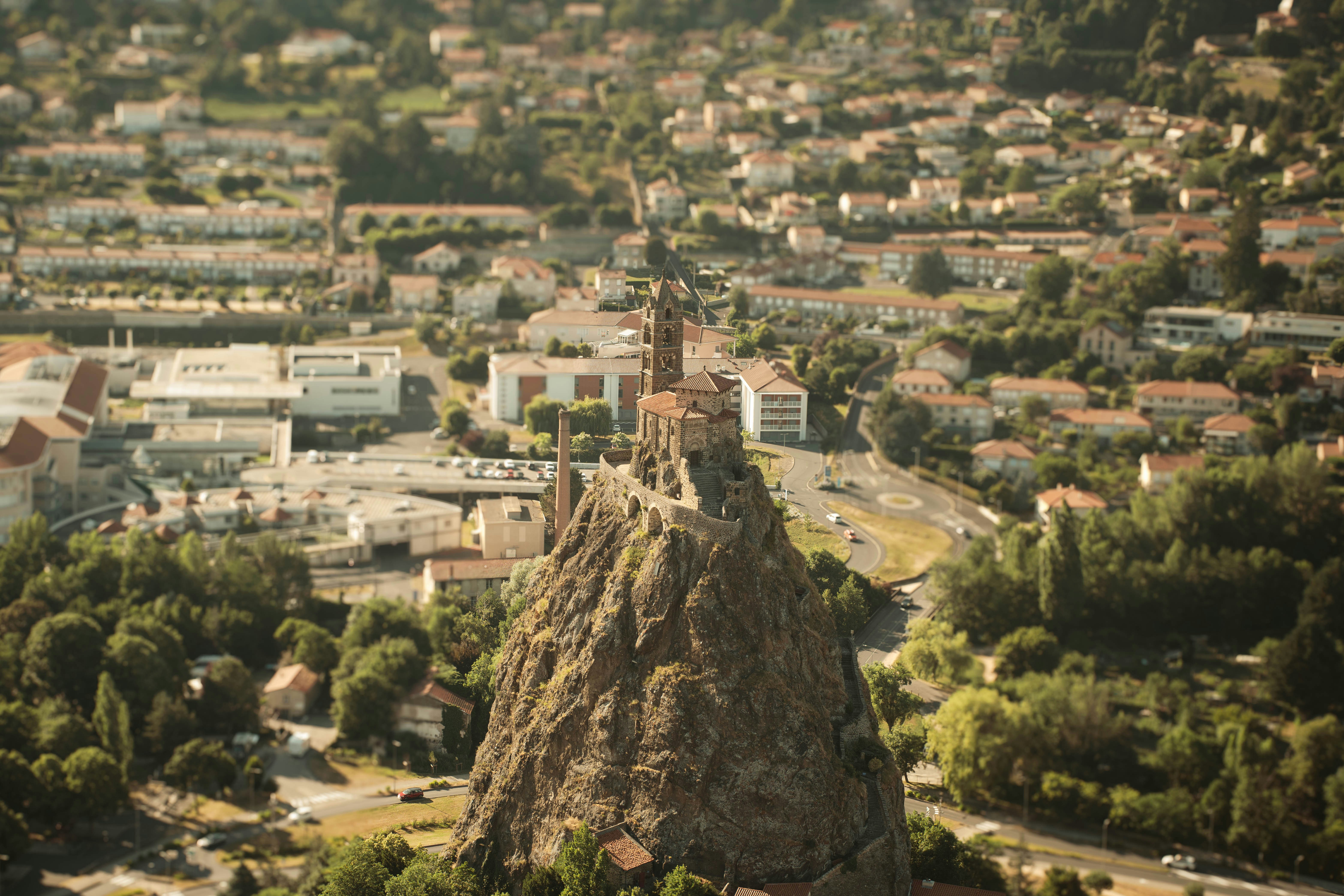 Castle perched atop a rocky outcrop overlooking town