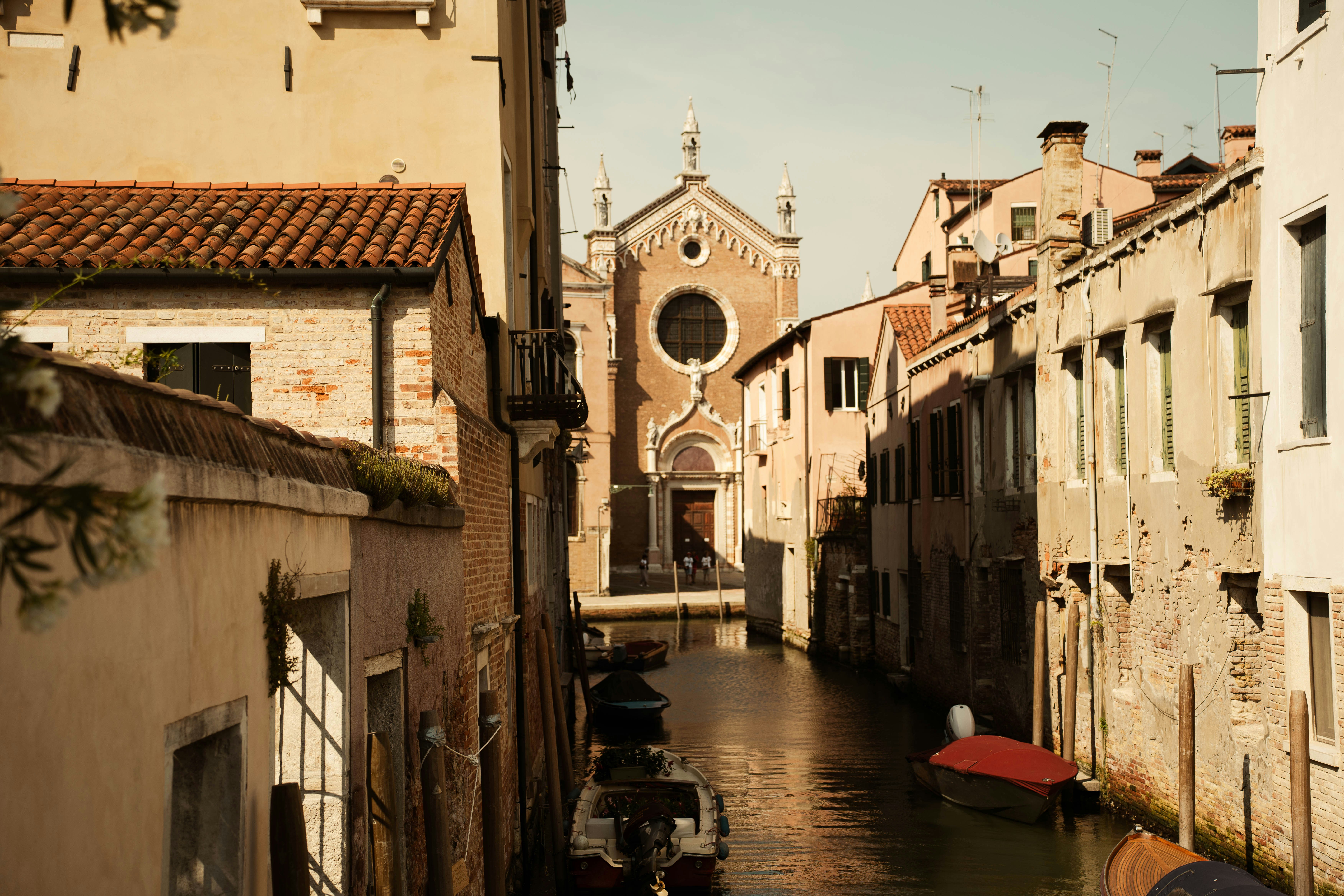 Narrow canal in venice with historic buildings