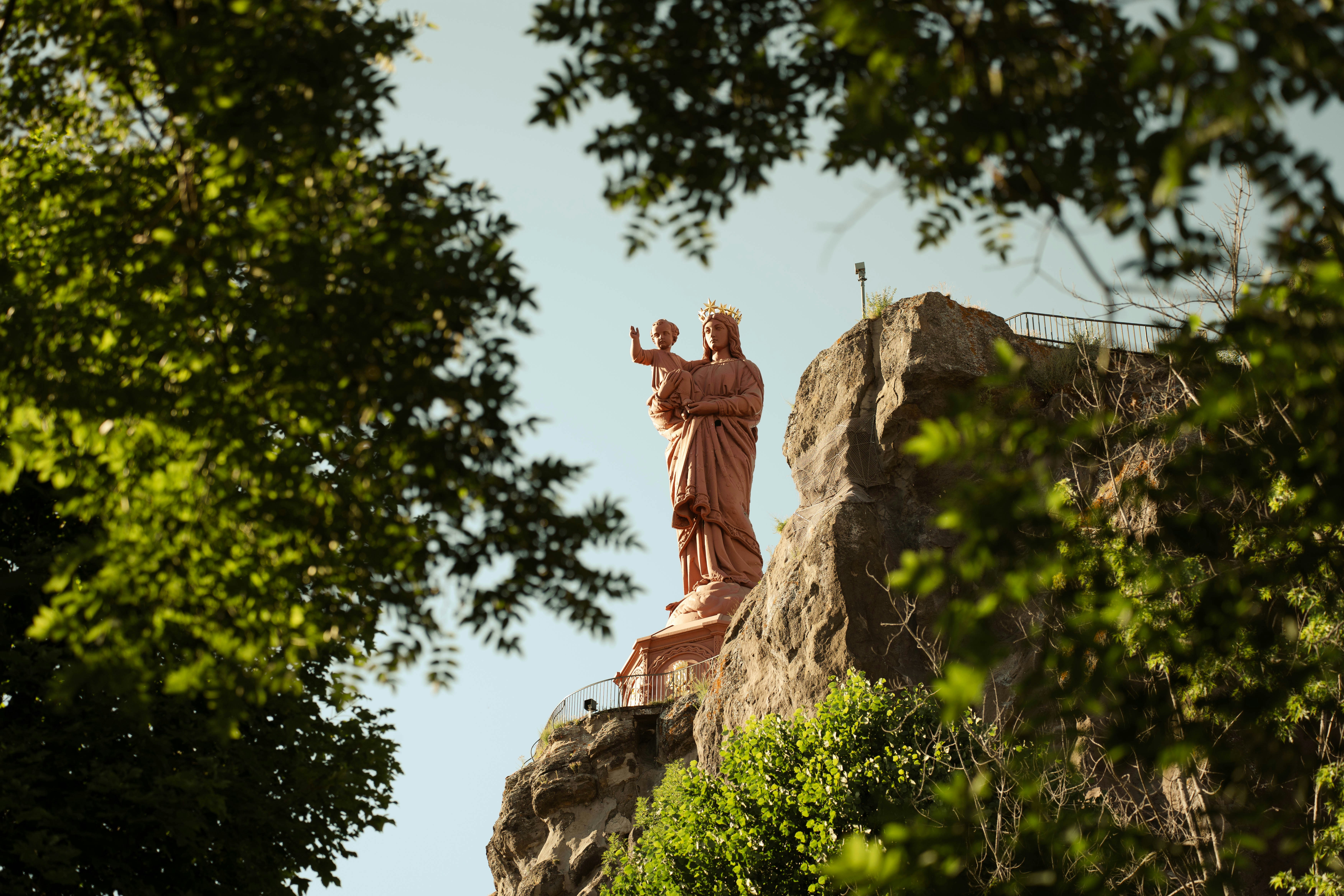 Statue of christ the redeemer on a rocky outcrop