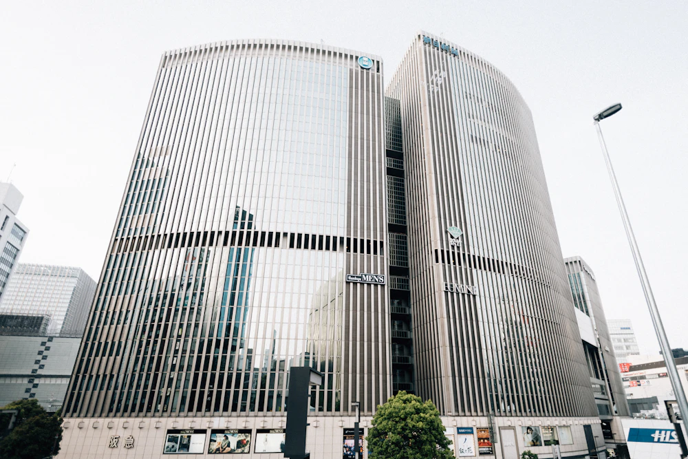 Modern glass office buildings against a cloudy sky