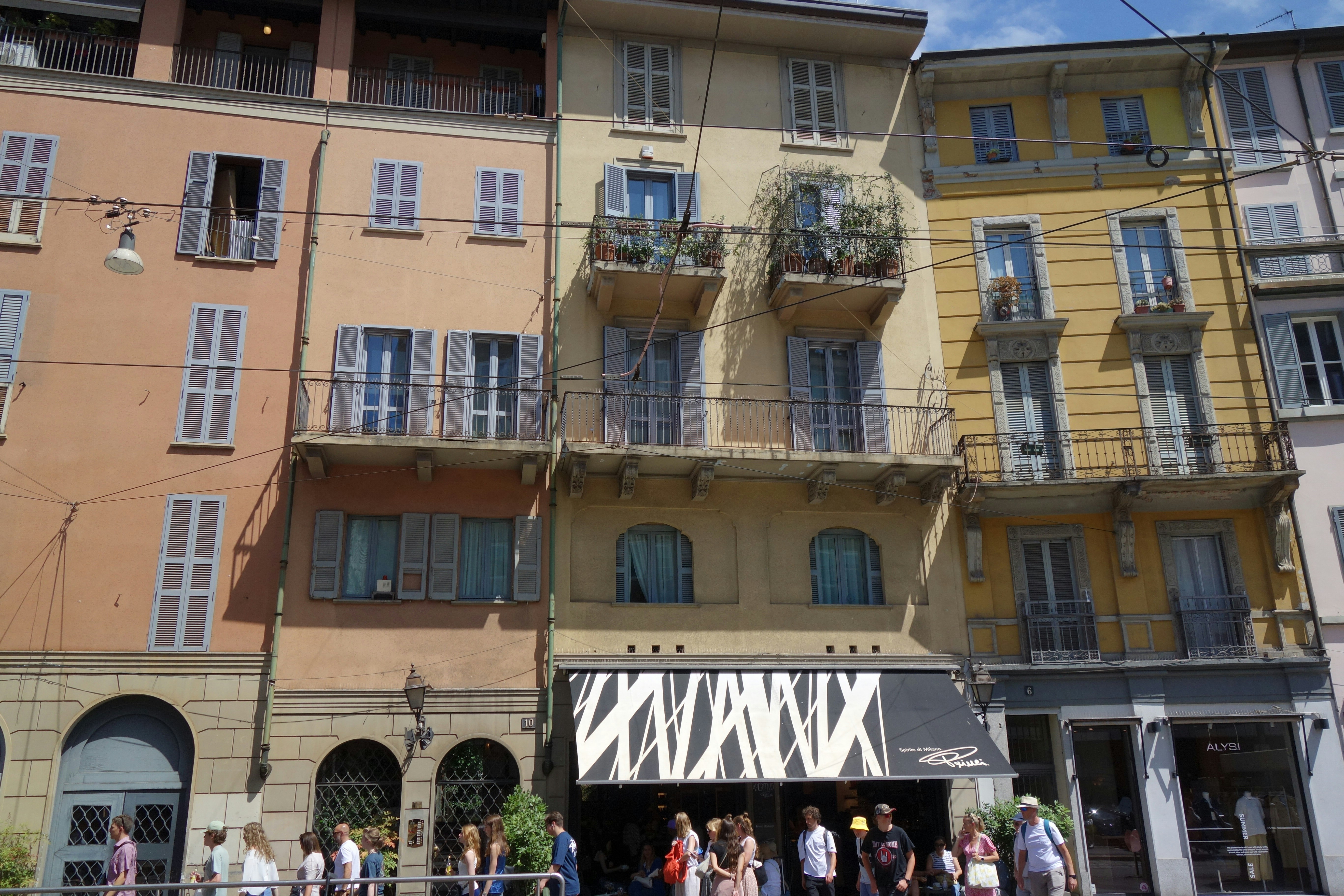 Colorful buildings with shutters and balconies on street